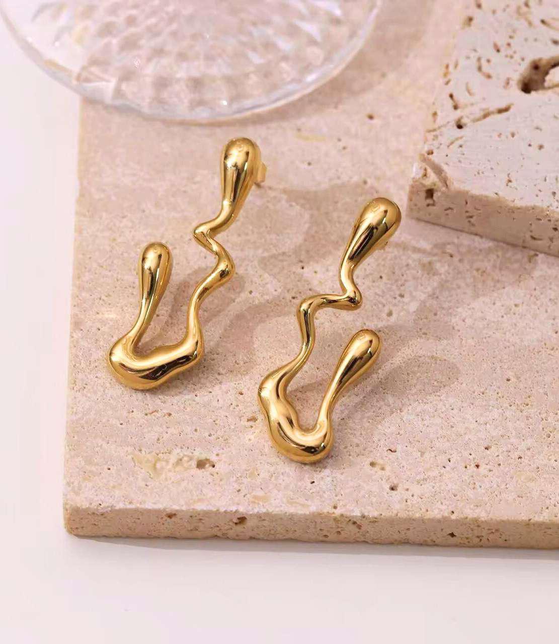 Abstract Wave Stud Earrings – Modern Minimal Jewelry Abstract wave stud earrings in gold finish – modern minimalist jewelry