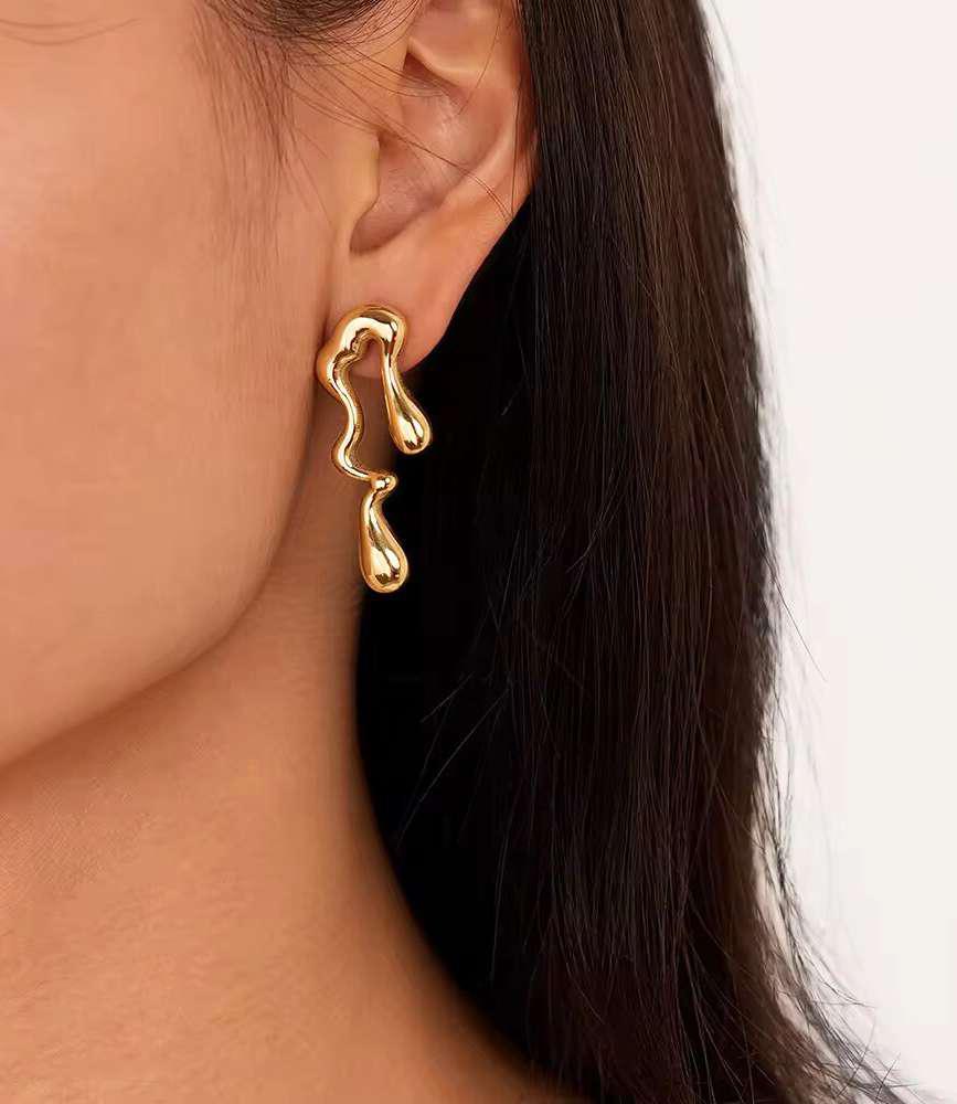 Abstract Wave Stud Earrings – Modern Minimal Jewelry Abstract wave stud earrings in gold finish – modern minimalist jewelry