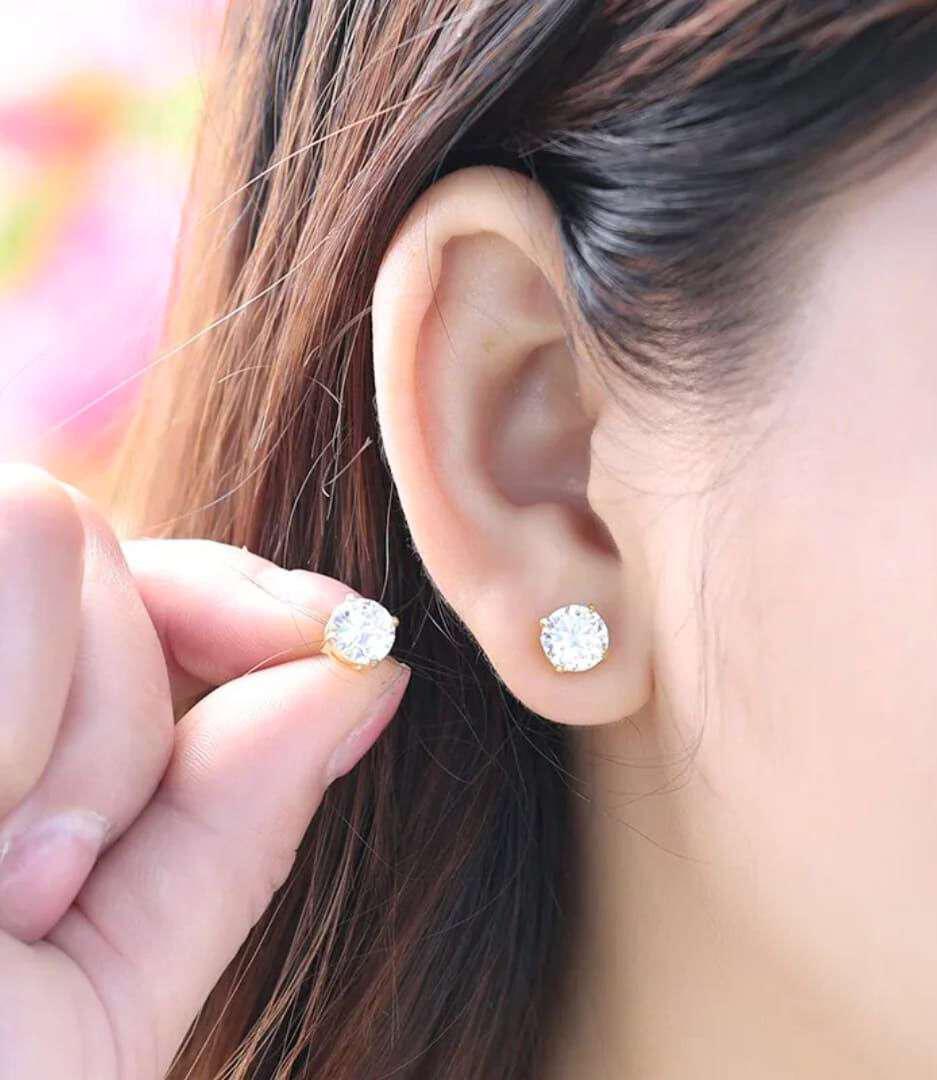 Crystal Stud Earrings – Classic Solitaire Stud Jewelry on Model Crystal stud earrings with gold finish and round solitaire design