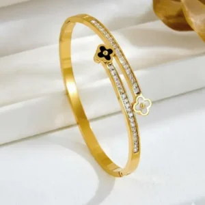 Dual clover crystal cuff bangle in gold finish by Bougee Jewels