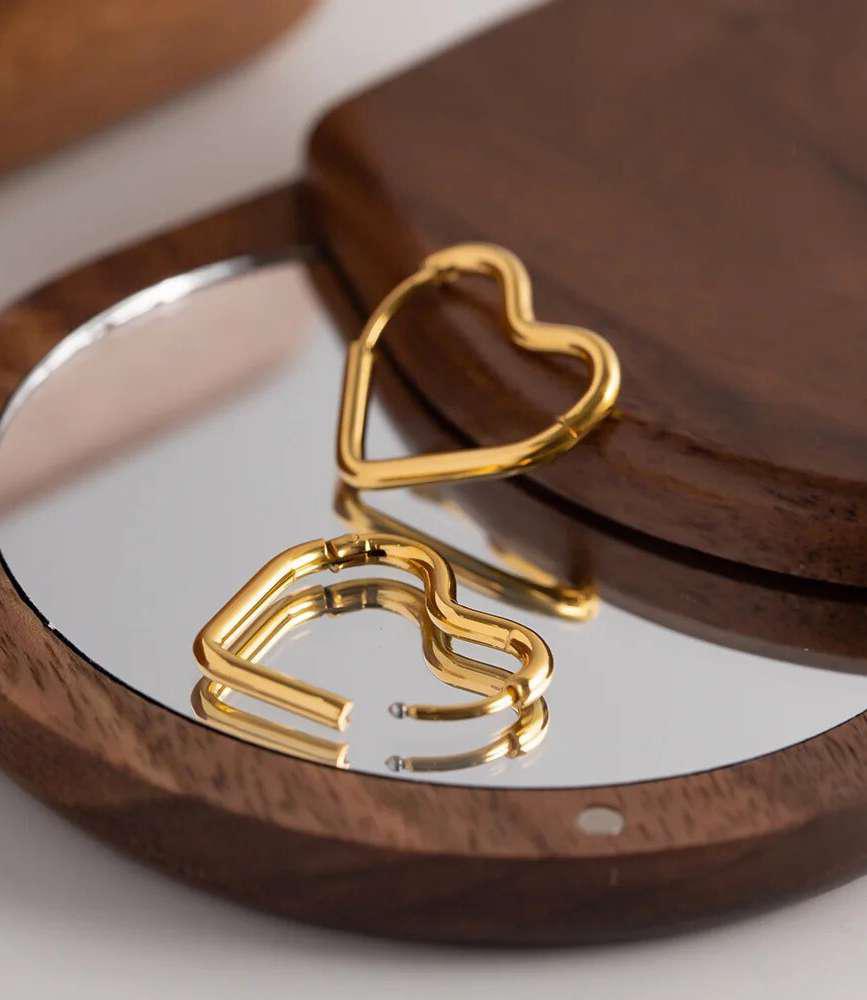 Heart Hoop Earrings – Minimal Golden Hoop Jewelry Heart hoop earrings in golden finish with minimal modern design
