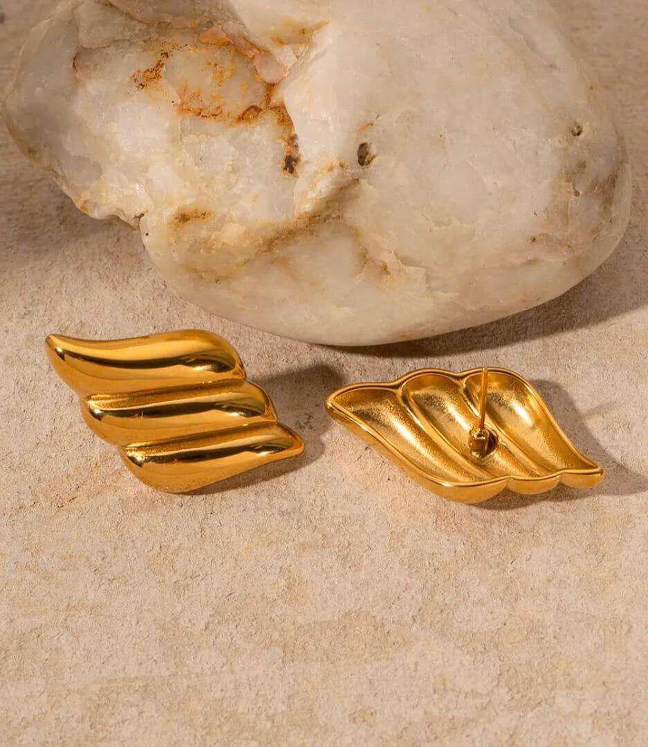 Leaf Stud Earrings β Elegant Gold Nature Inspired Jewelry Gold leaf stud earrings with textured nature-inspired design