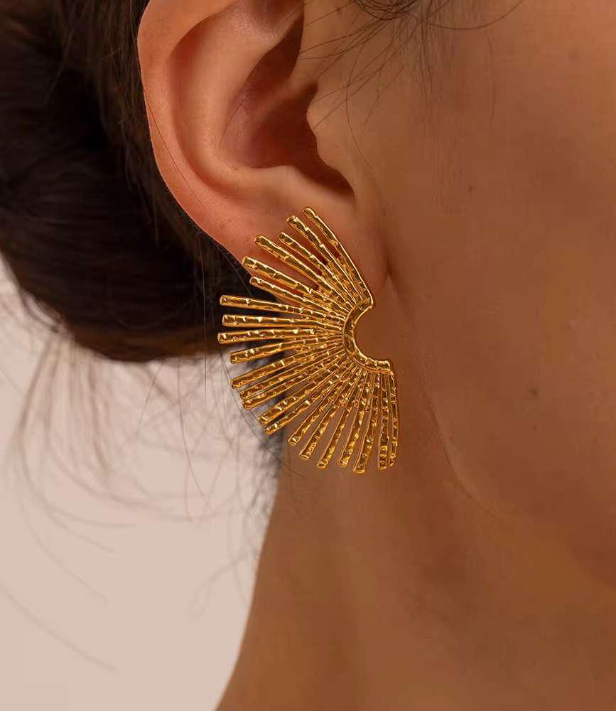 Sunburst Fan Stud Earrings – Statement Gold Studs by Bougee Jewels Sunburst fan stud earrings in gold finish by Bougee Jewels on model