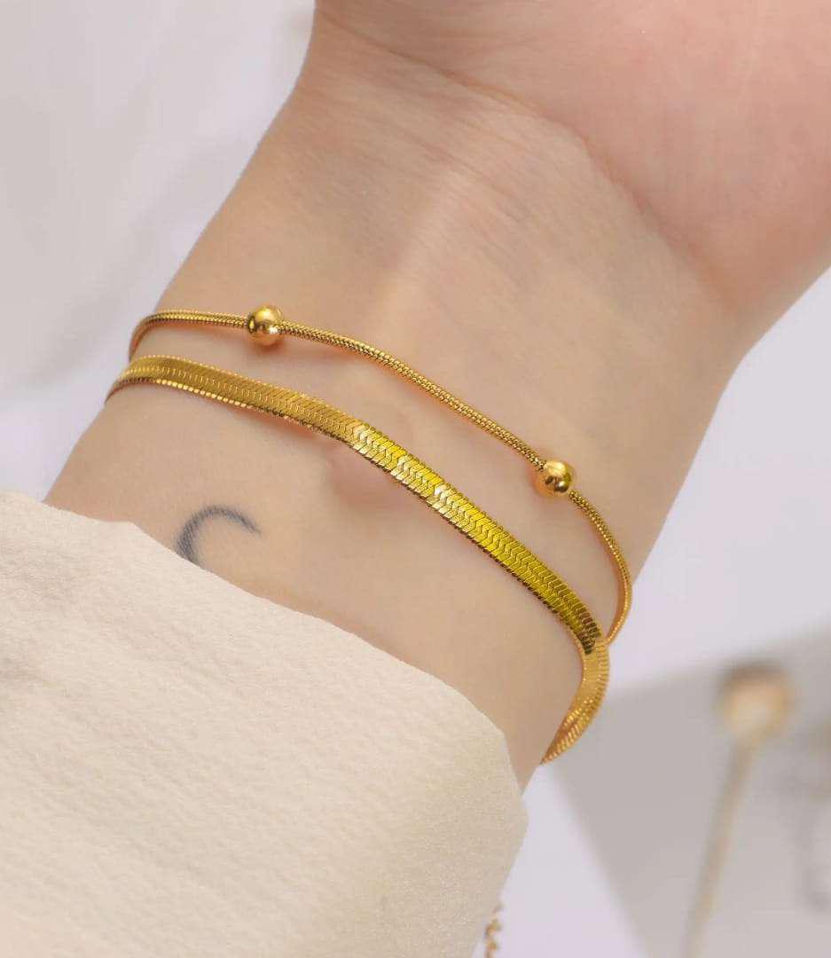 Dual Layer Snake Bone Bracelet on hand – Bougee Jewels Dual layer snake bone bracelet with golden finish by Bougee Jewels