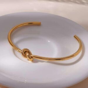 Minimal knot cuff bangle in golden finish by Bougee Jewels