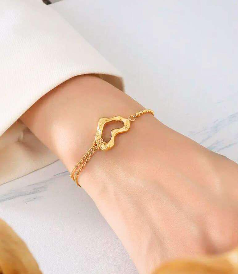 Open Heart Chain Bracelet on hand – Bougee Jewels Open heart chain charm bracelet with golden finish on hand by Bougee Jewels